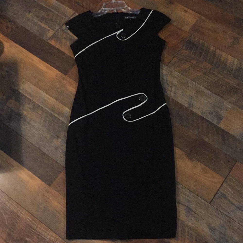 Black dress with white piping trim and buttons